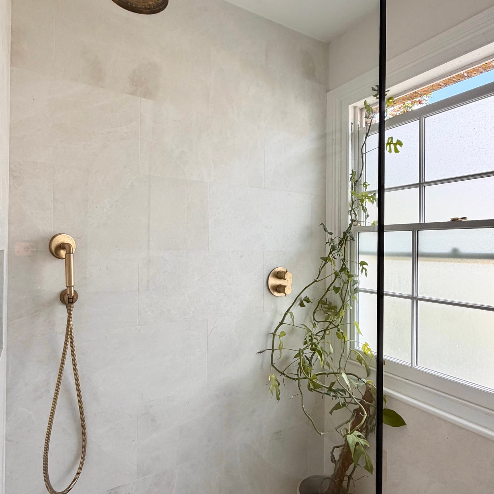 Kennington House walk-in shower with brass fittings