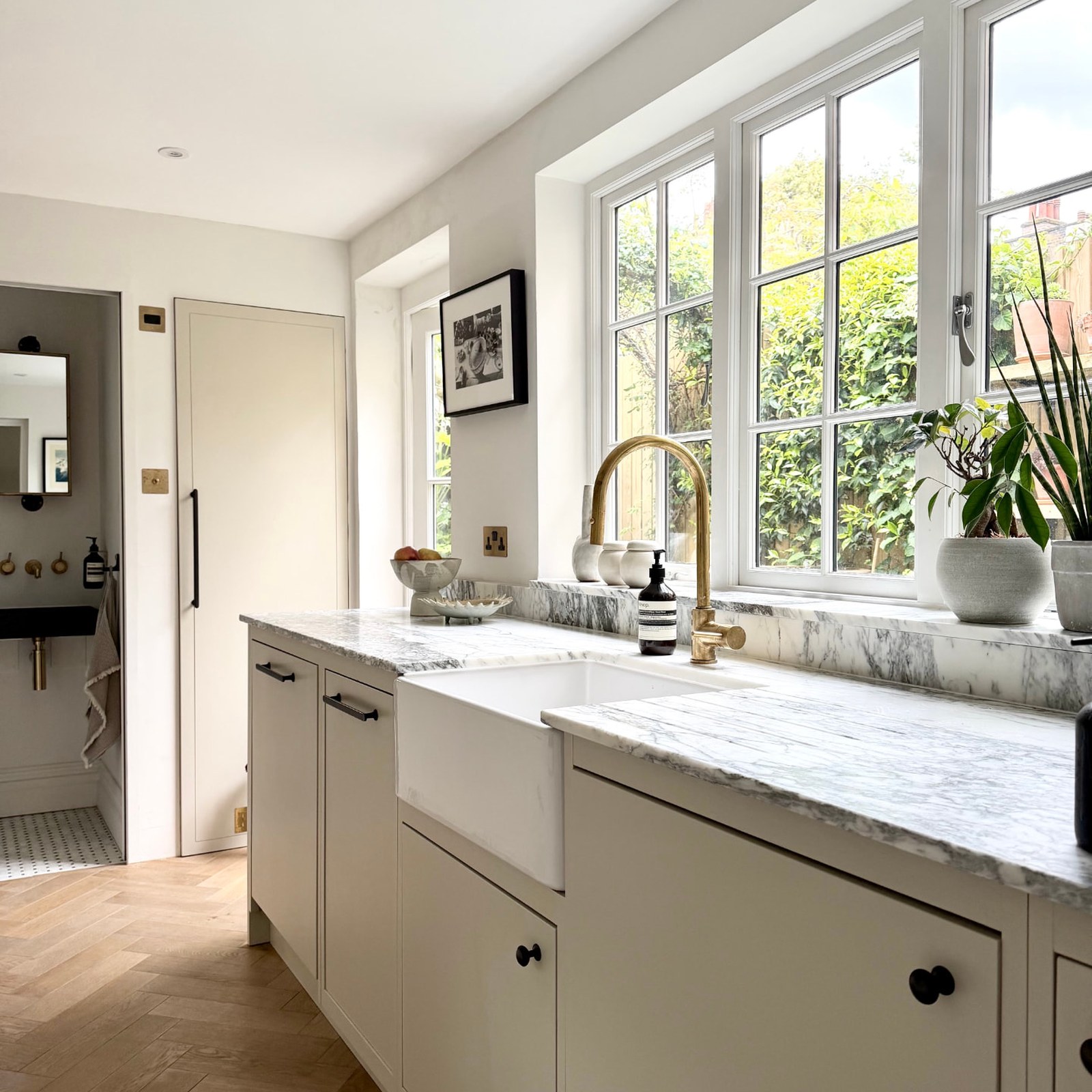 Kennington House kitchen with brass tap and marble worktop