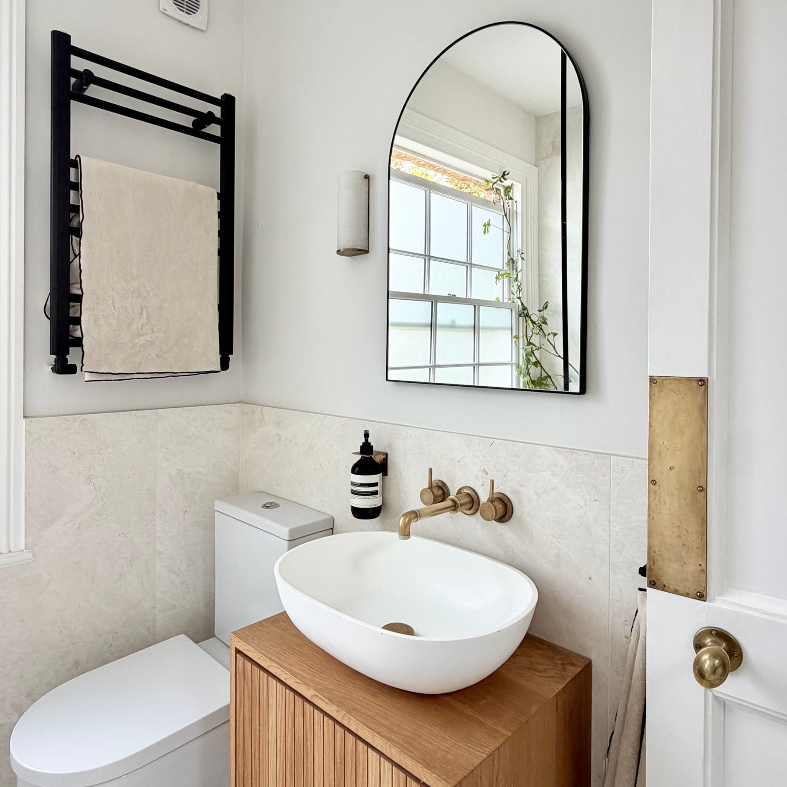 Kennington House bathroom vanity with oak unit and brass taps
